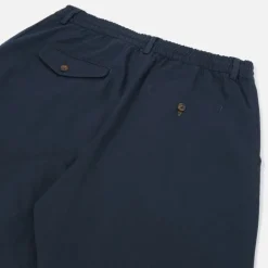 UNIVERSAL WORKS Pleated Track Pant in Navy
